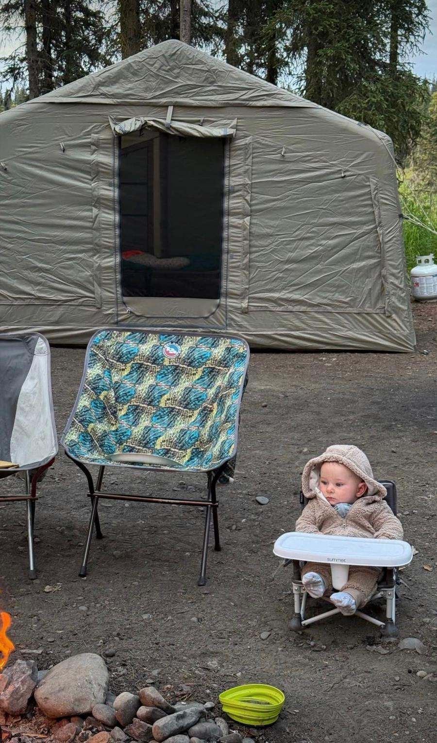 K1 Outdoors tent at a campsite with a family by the campfire